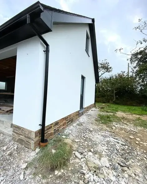 Existing home re-rendered with a fresh white finish